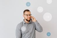 Man in Gray Long Sleeve Shirt Wearing Black Framed Eyeglasses