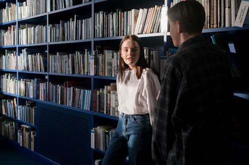 Two Students Talking inside the Library