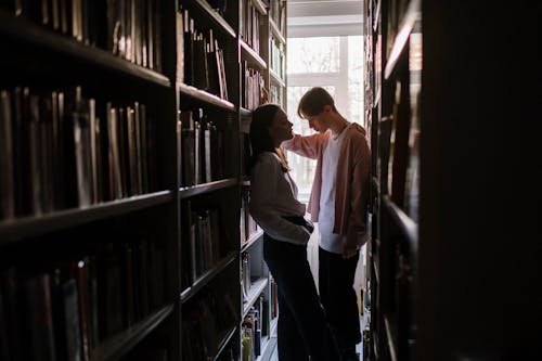 Two Students Talking inside the Library