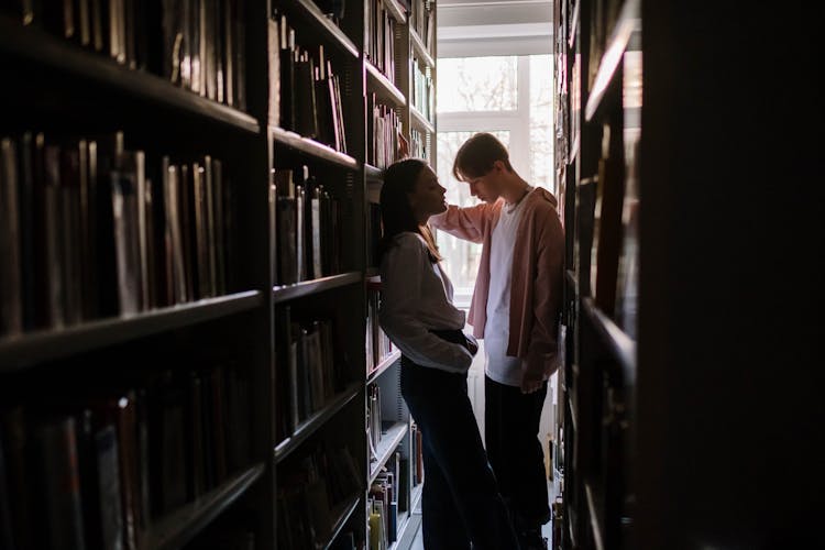 Two Students Talking Inside The Library