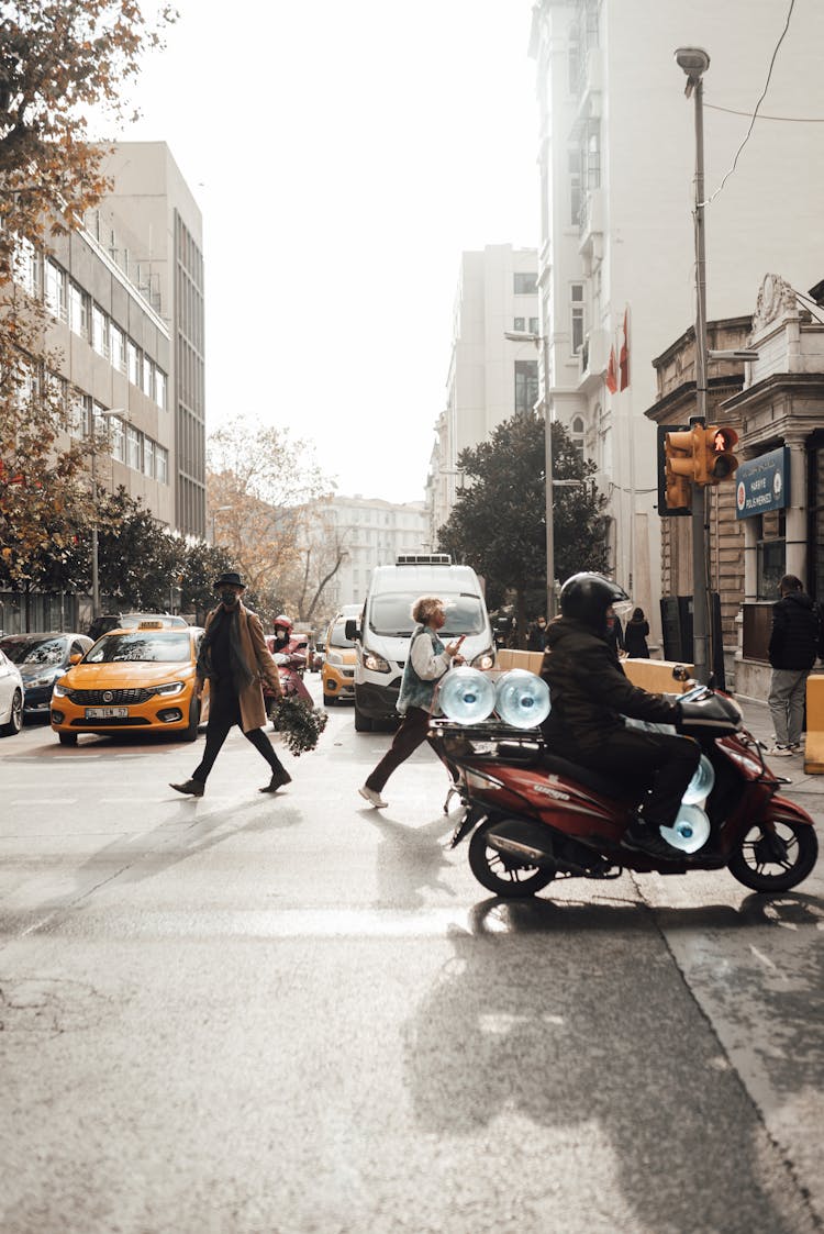 People In Mask Crossing Road On Crossroad