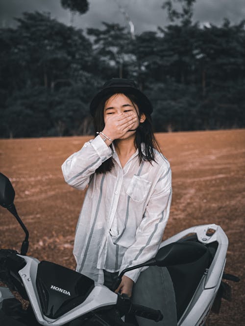 A Woman Riding a Motorcycle