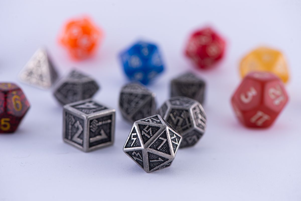 Assorted polyhedral dice collection representing history of DND dice