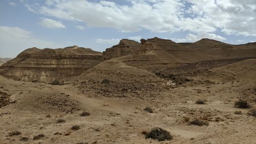 Free Explore a serene desert landscape with rolling hills and a bright blue sky, showcasing natural beauty. Stock Photo