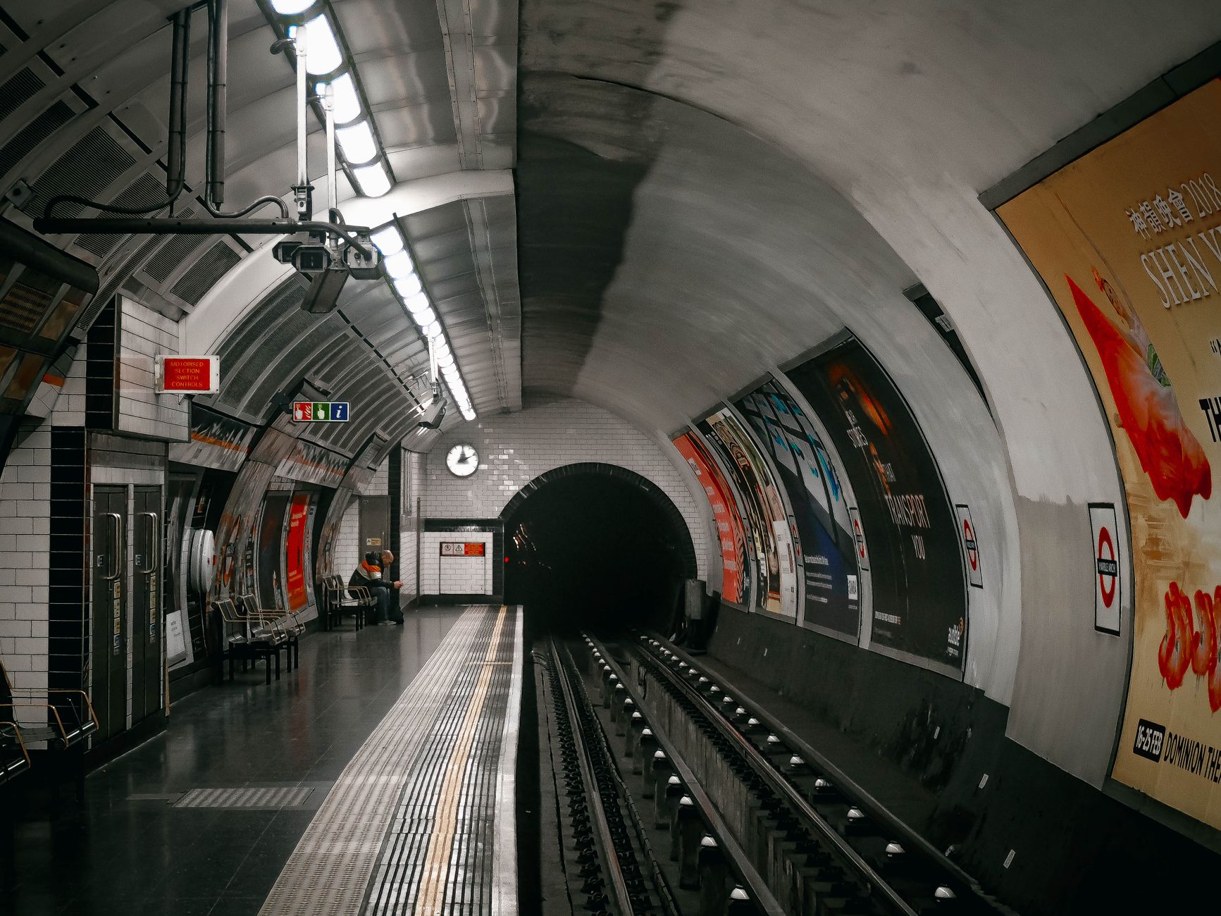 View of an empty platform in the London Underground, capturing the waiting area and tunnel.
