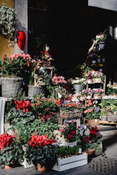 Colorful flower shop display in Milan, capturing vibrant bouquets and greenery in natural sunlight.