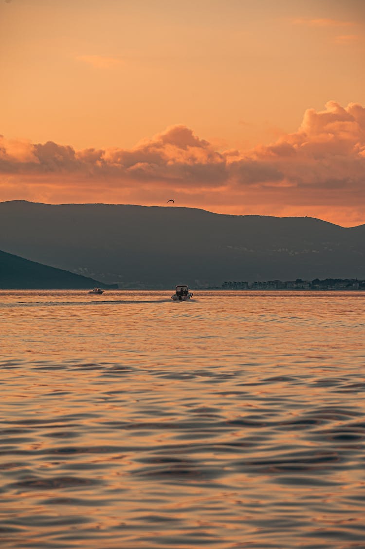 A Speedboat On The Sea During Sunset