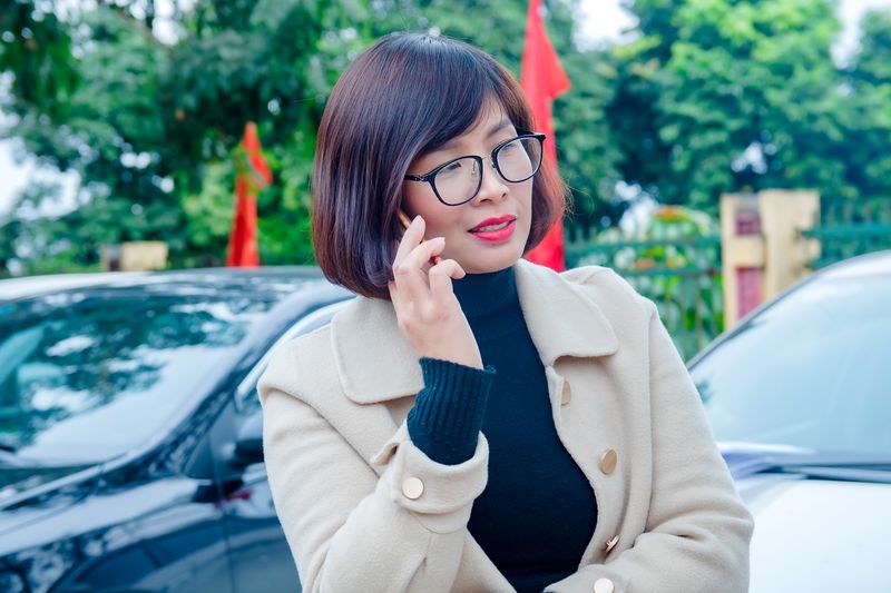Person checking a phone in a parked car