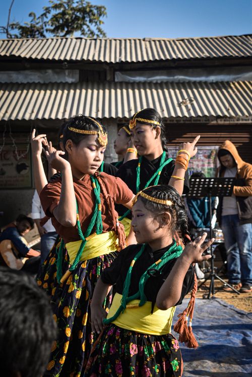 Free Group of children performing traditional Asian dance outdoors. Stock Photo