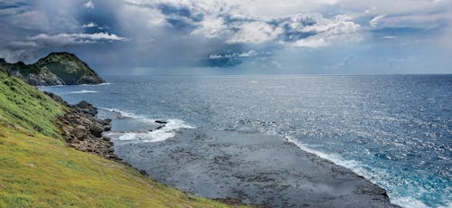 Body of Water Near Mountain