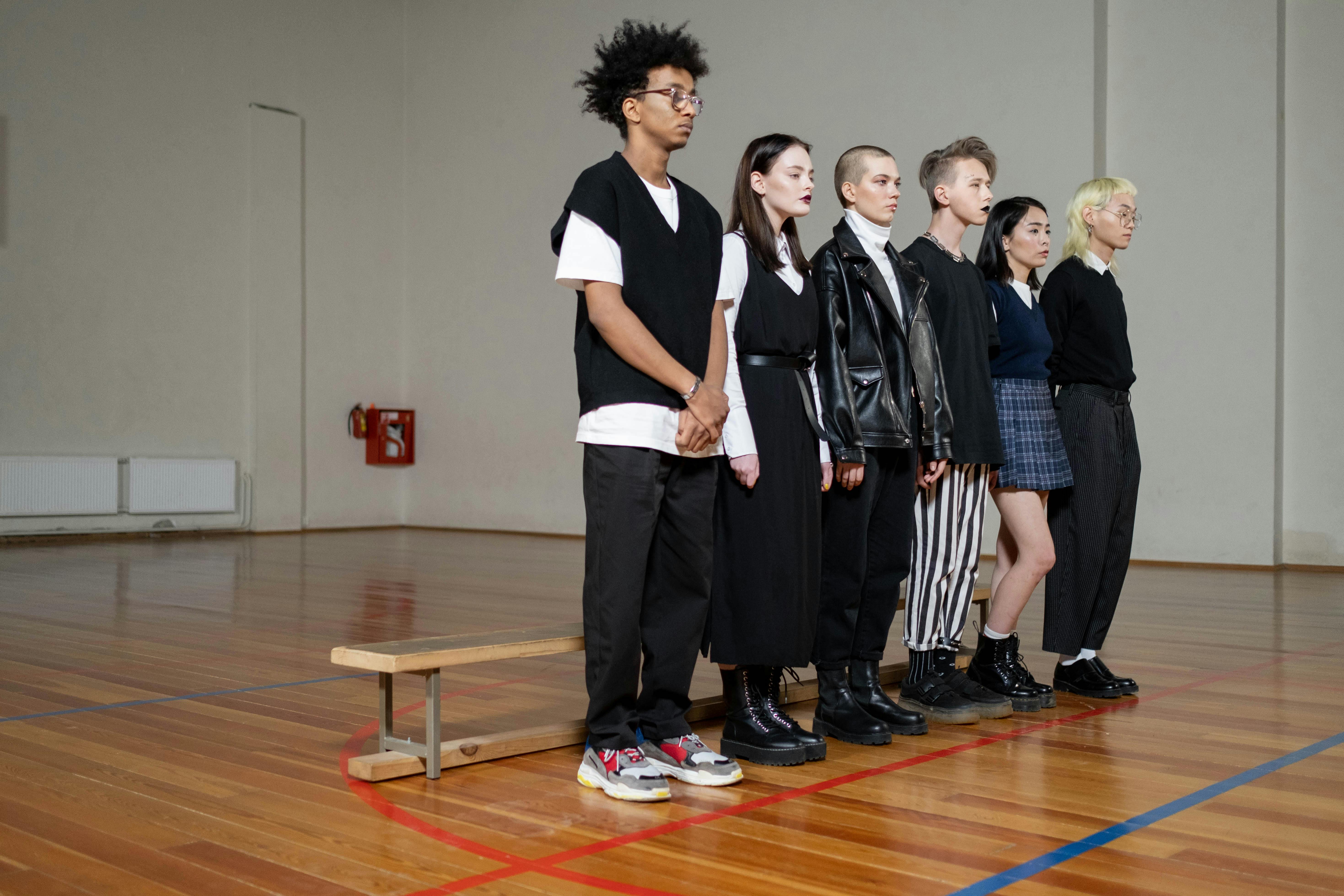 a group of students standing in the gym