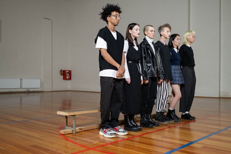 A Group Of Students Standing In The Gym