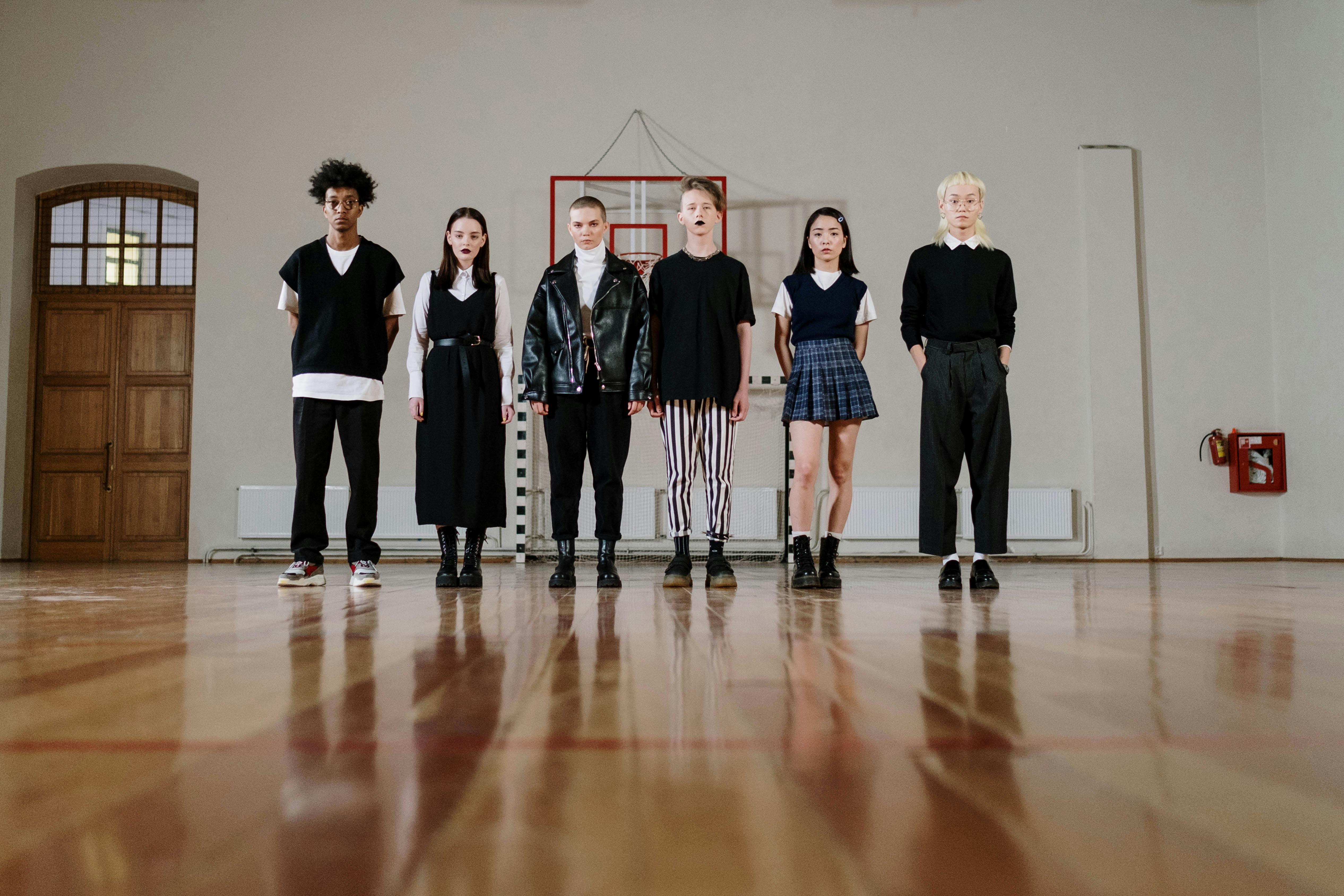 a group of students standing in the gym