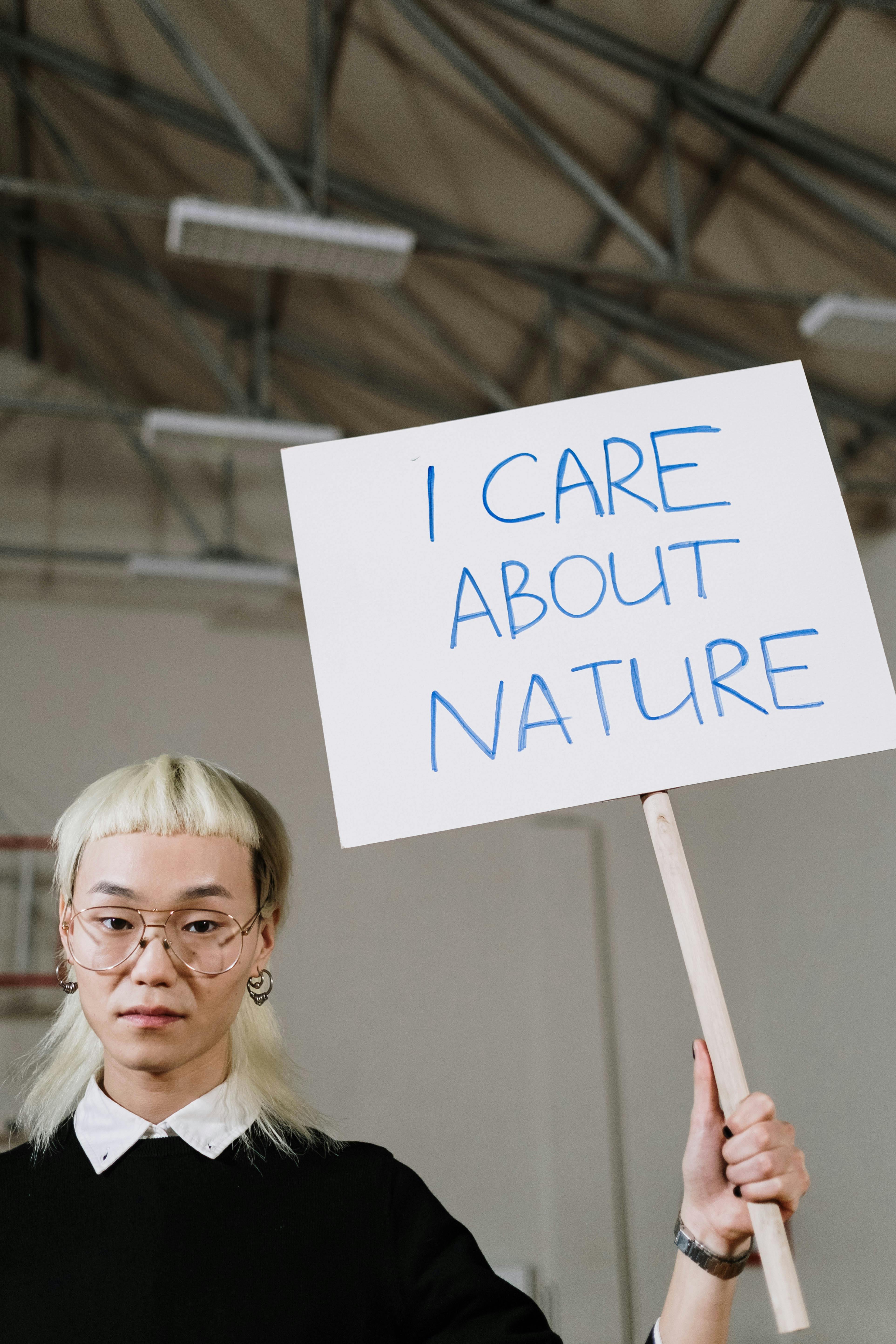 a man holding a poster