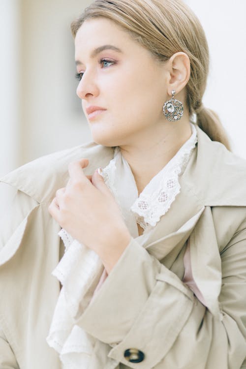 Close-Up Shot of a Pretty Woman in Beige Coat