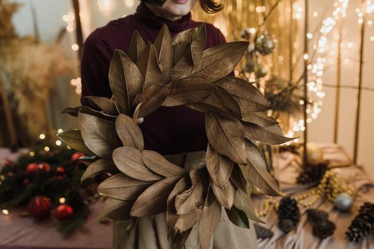 Woman Holding Brown Leaves