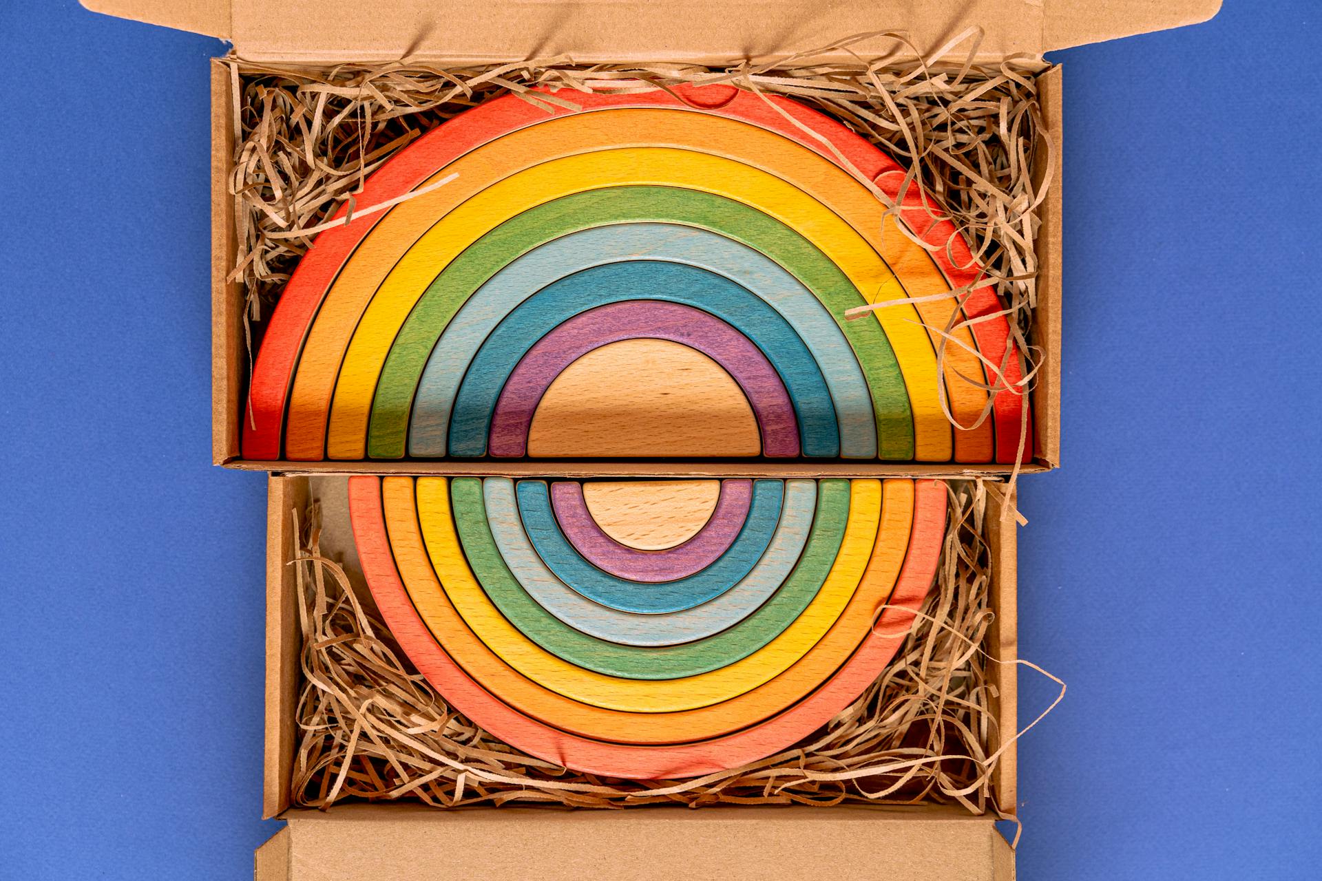 Vibrant wooden rainbow decor packed in eco-friendly gift box.