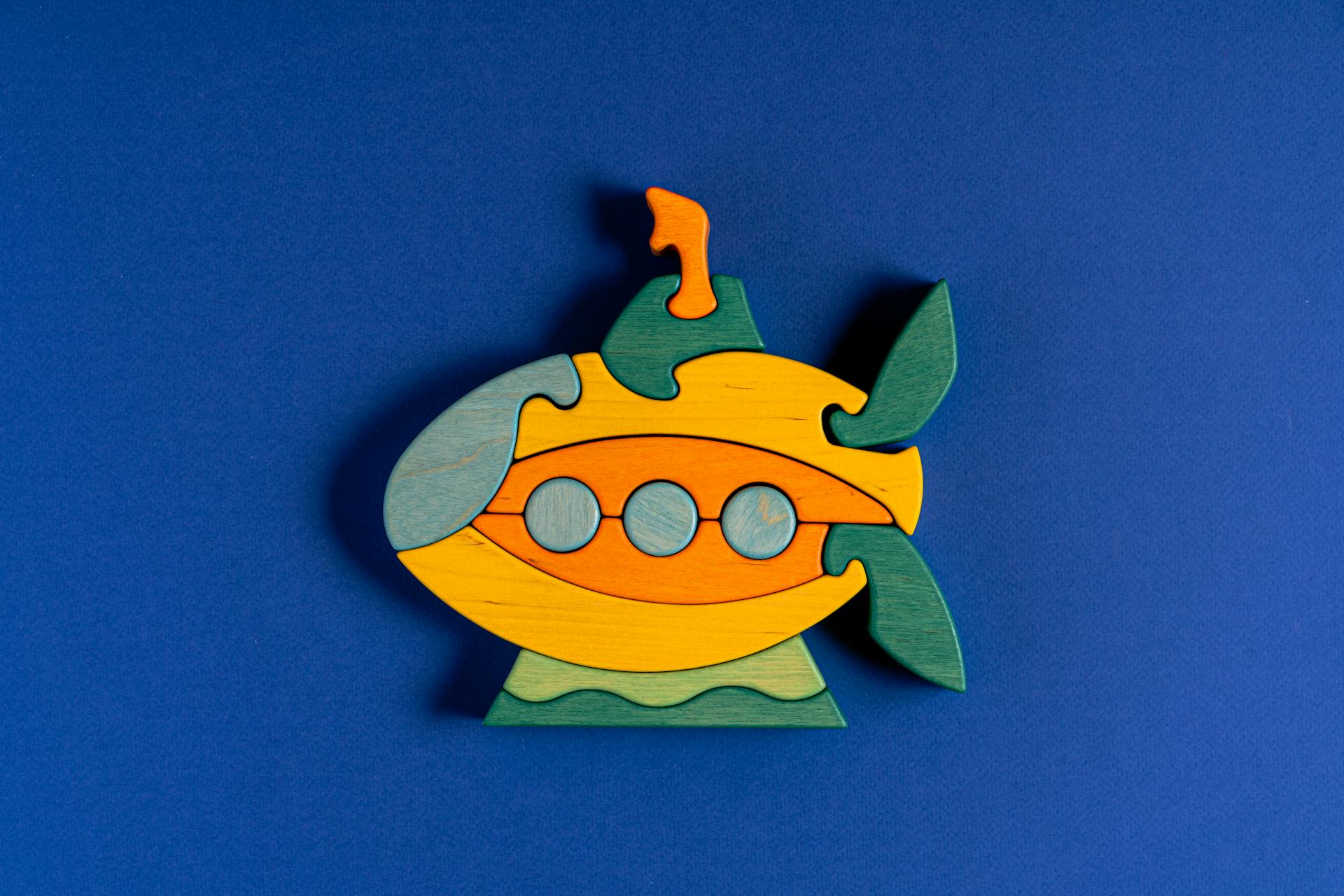 Submarine Shaped Figurine on Blue Background