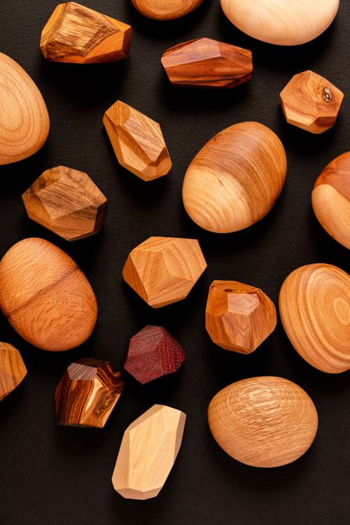 Free A collection of crafted wooden geometric forms showcasing natural wood tones and textures. Stock Photo