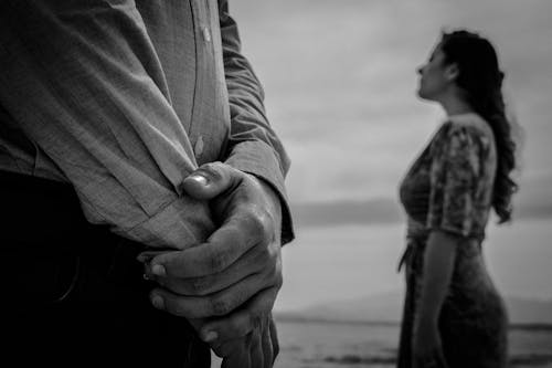 Grayscale Photo of Hands