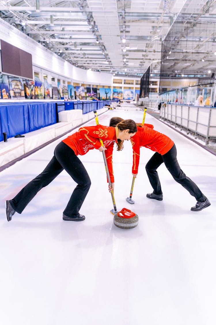 Women Playing In The Curling Rink