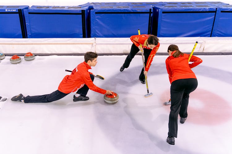 People Playing In The Curling Rink