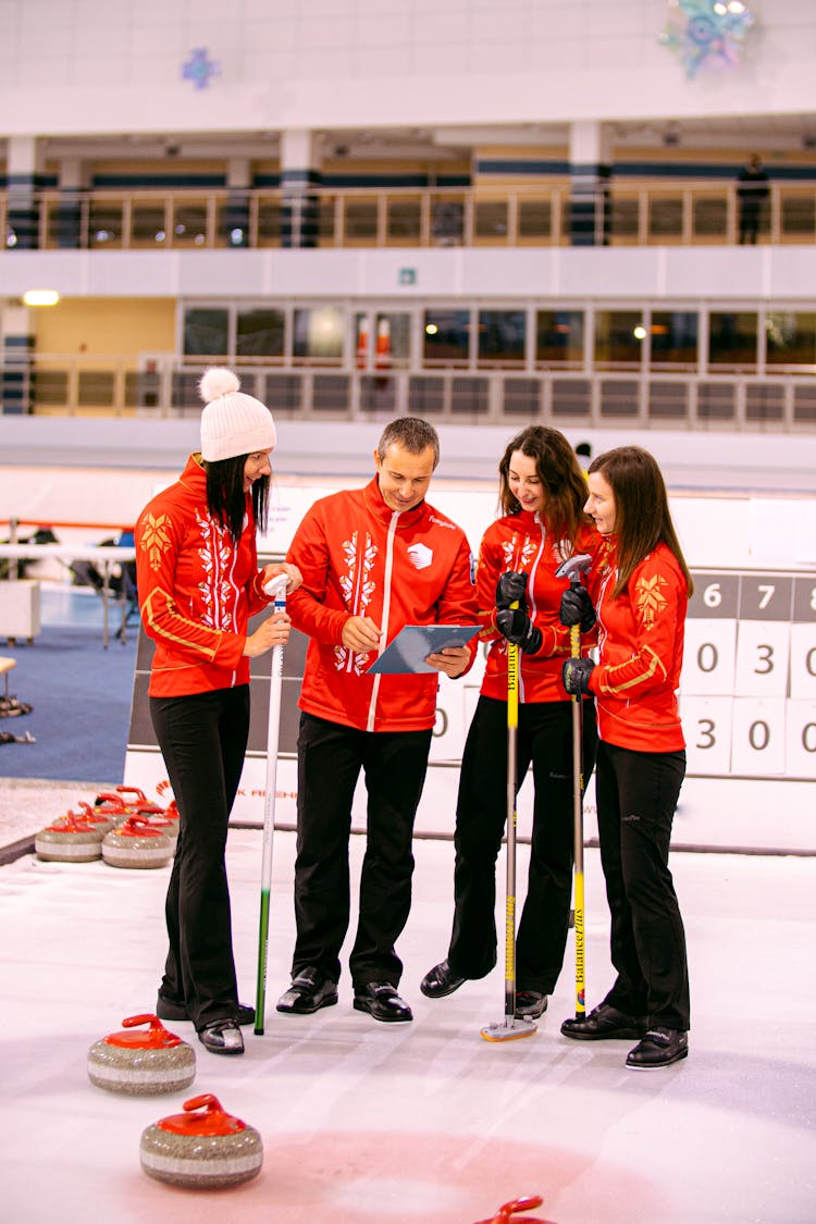 People Standing In The Curling Rink