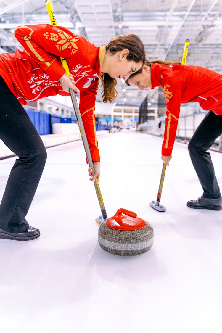 Women Playing In The Curling Rink