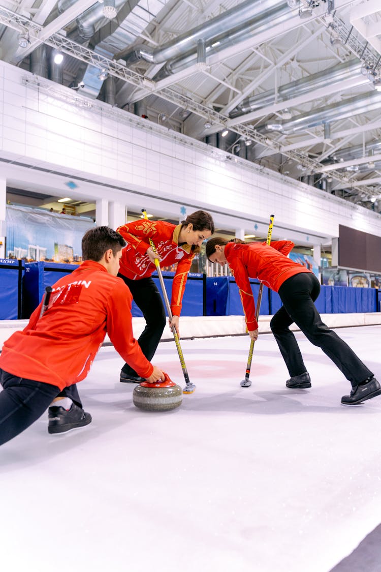 People Playing In The Curling Rink