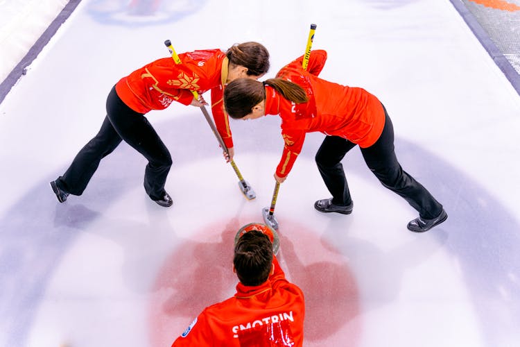 People Playing In The Curling Rink