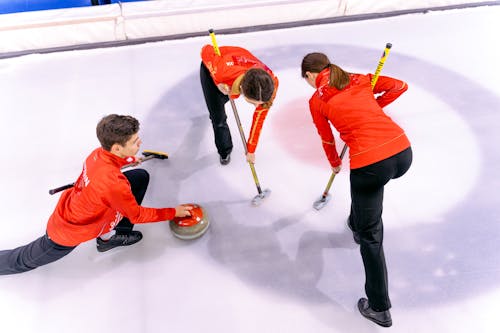 People Playing in the Curling Rink