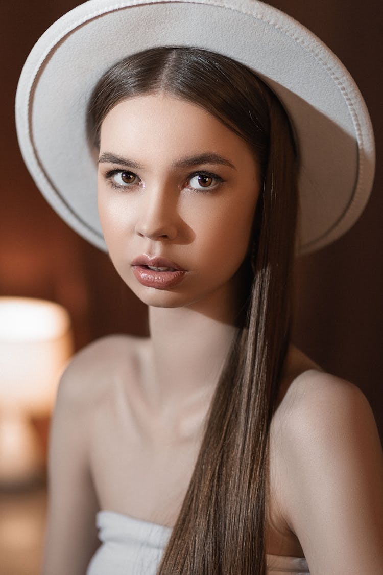 Tender Teenager In Felt Hat With Makeup