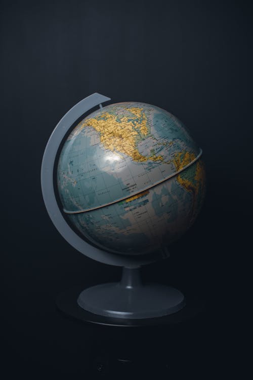 Globe On Stand Against Black Background