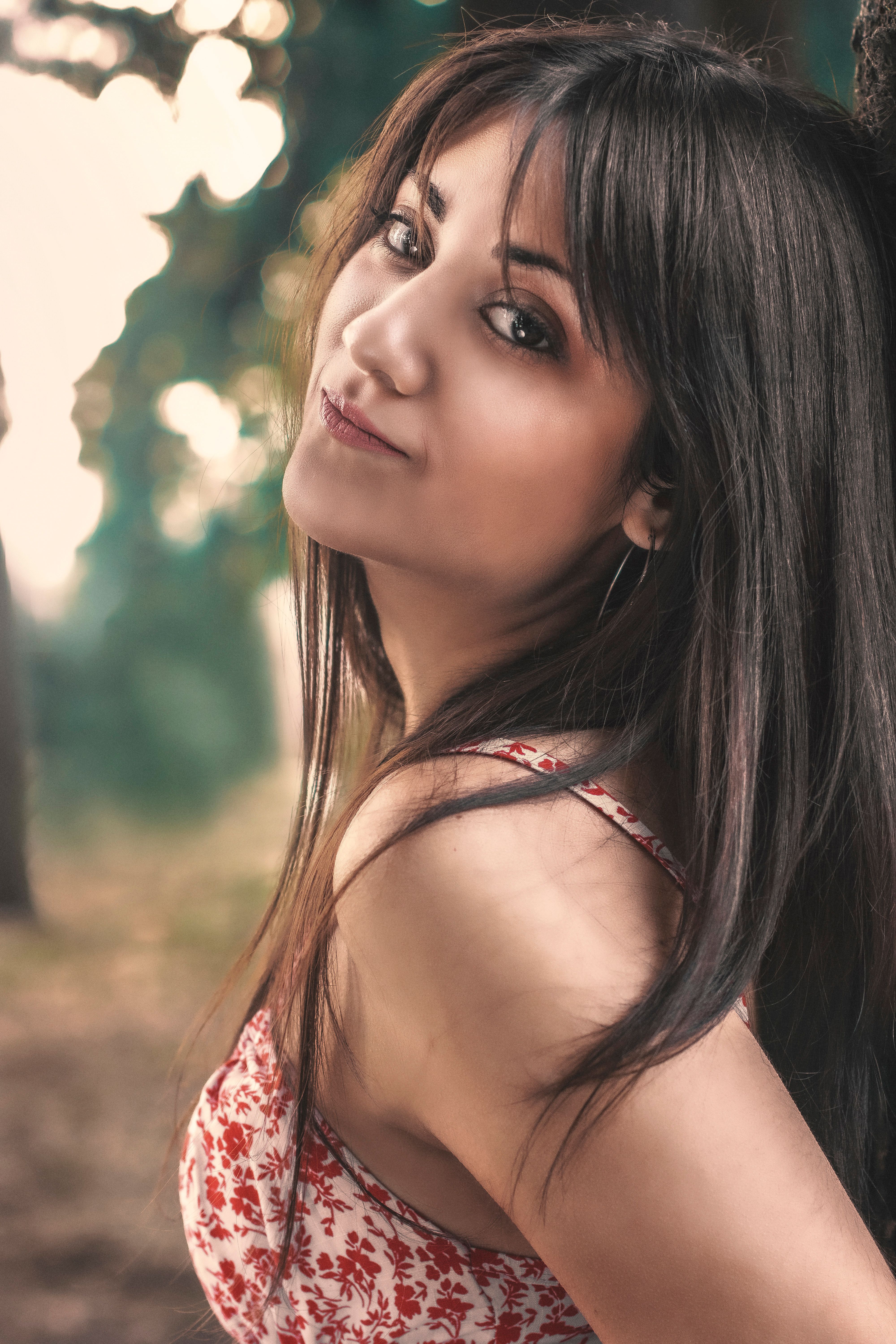 Portrait of a Beautiful Woman in Floral Top · Free Stock Photo