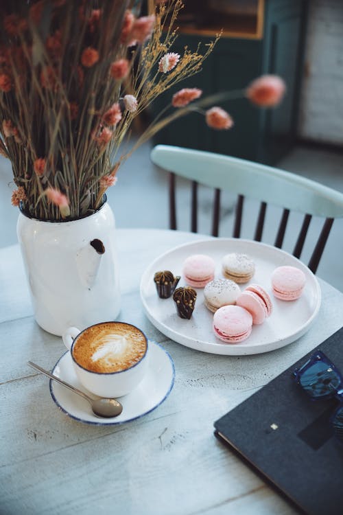 Free A Cup of Coffee beside Macarons Stock Photo