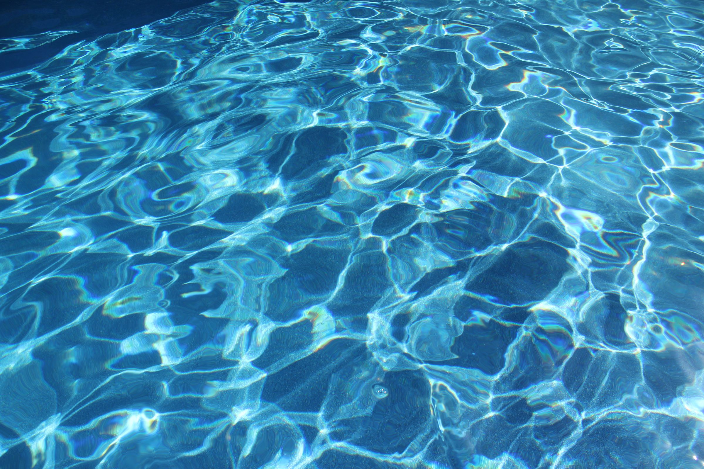 Crystal clear blue pool water after weekly service