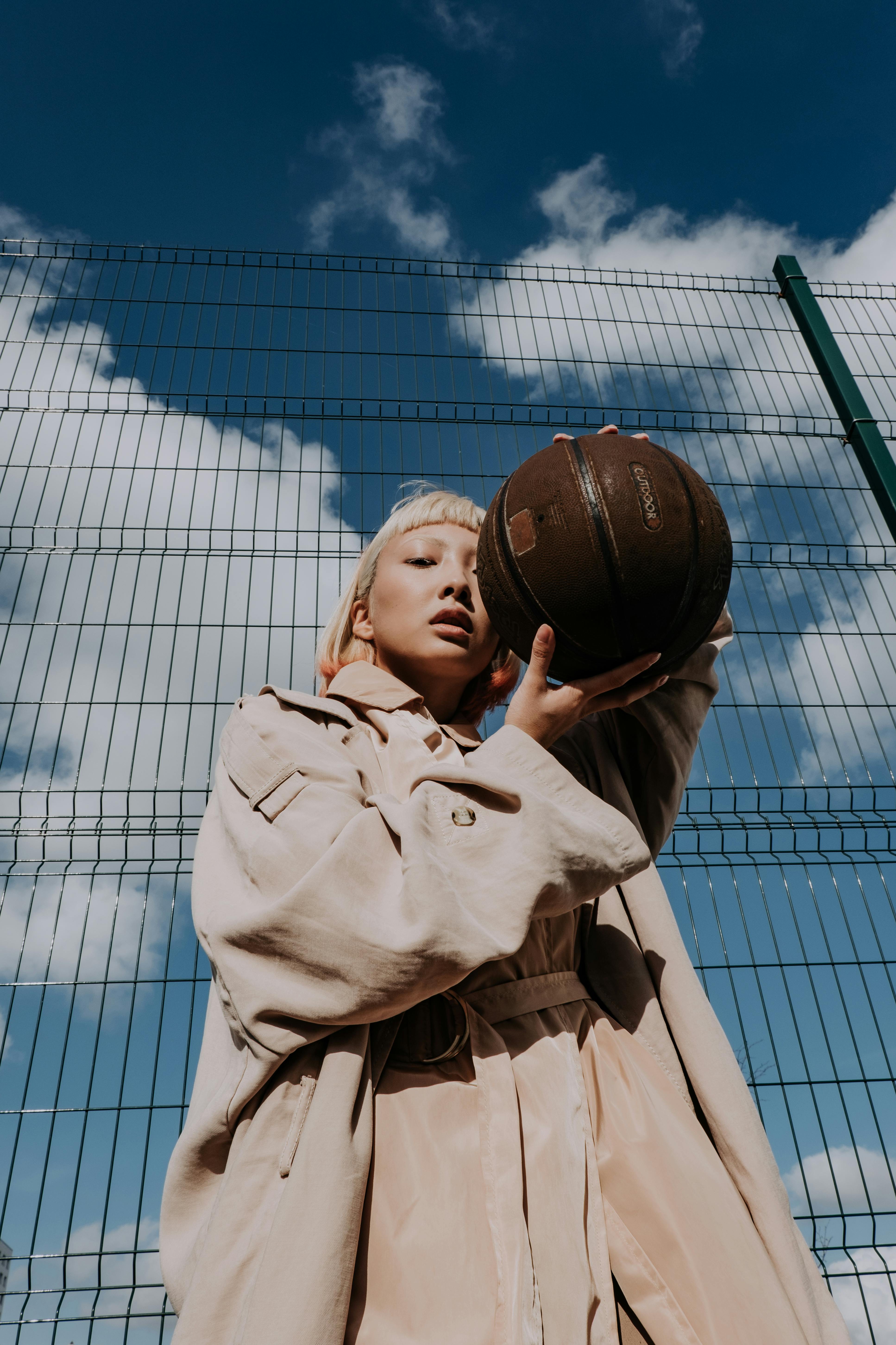 low angle shot of a woman wearing brown coat