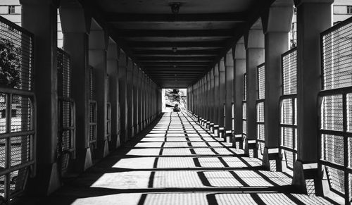 Free Black and white view of a footbridge in Rio de Janeiro with striking geometric shadows. Stock Photo