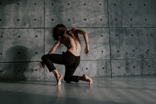 Free Shirtless Man Dancing Alone Stock Photo