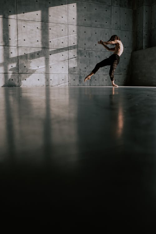 A Man Practicing Contemporary Dance Inside the Studio