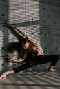 A Man Practicing Contemporary Dance near the Concrete Wall