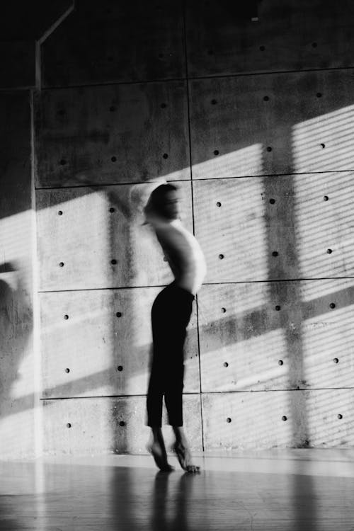 A Shirtless Man Dancing In Grayscale Photography