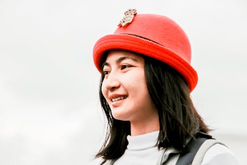 Close-Up Shot of a Pretty Woman with Red Hat