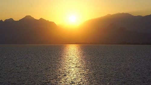 Sunset View with Lake and Mountains