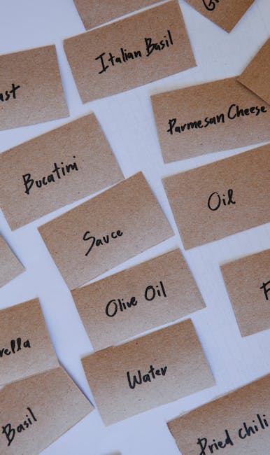 Close-up shot of various homemade dishes displayed on a table at a culinary swap shop, with handwritten labels.