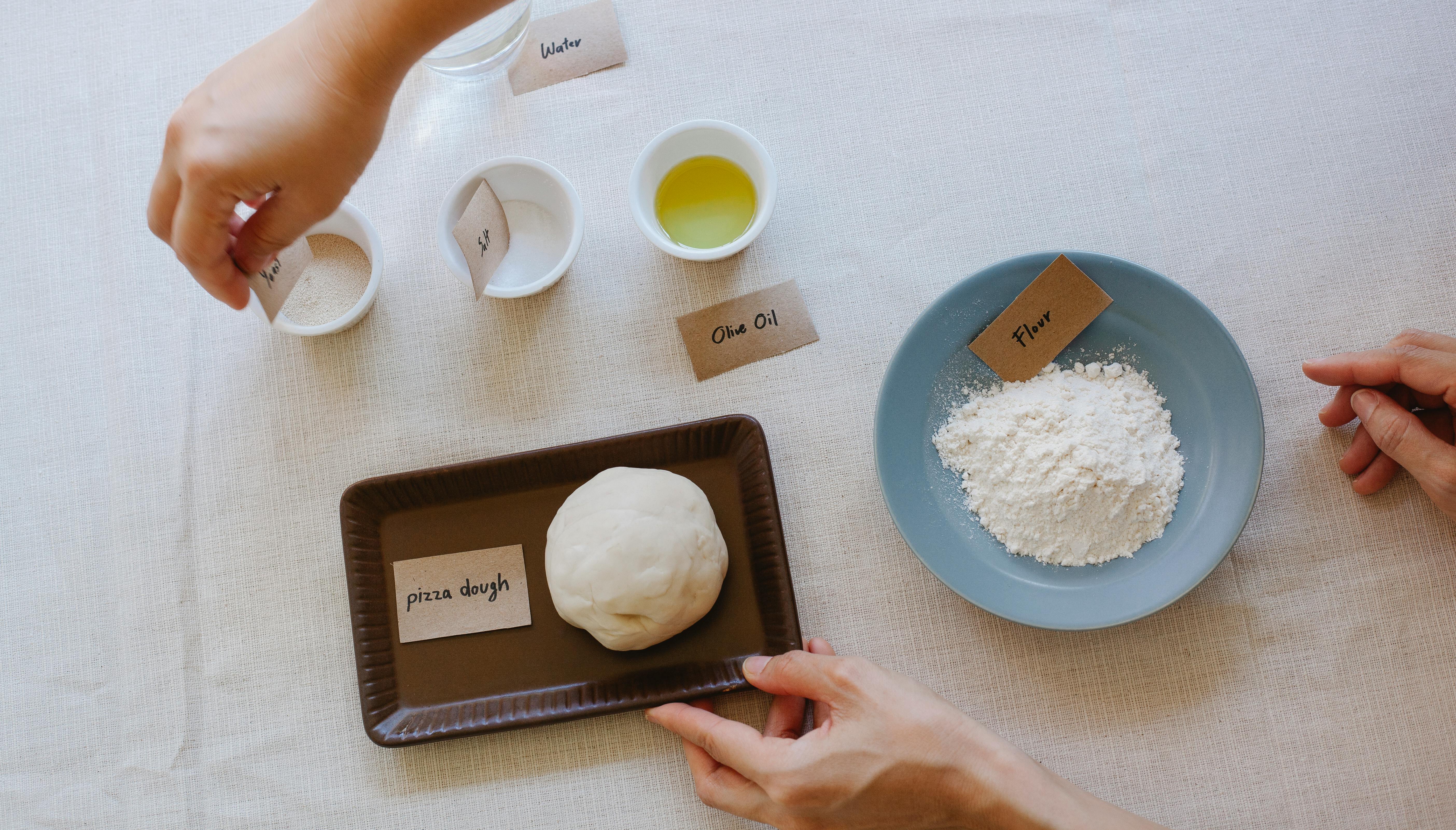 Measured and Labeled Ingredients for a Pizza Dough · Free Stock Photo