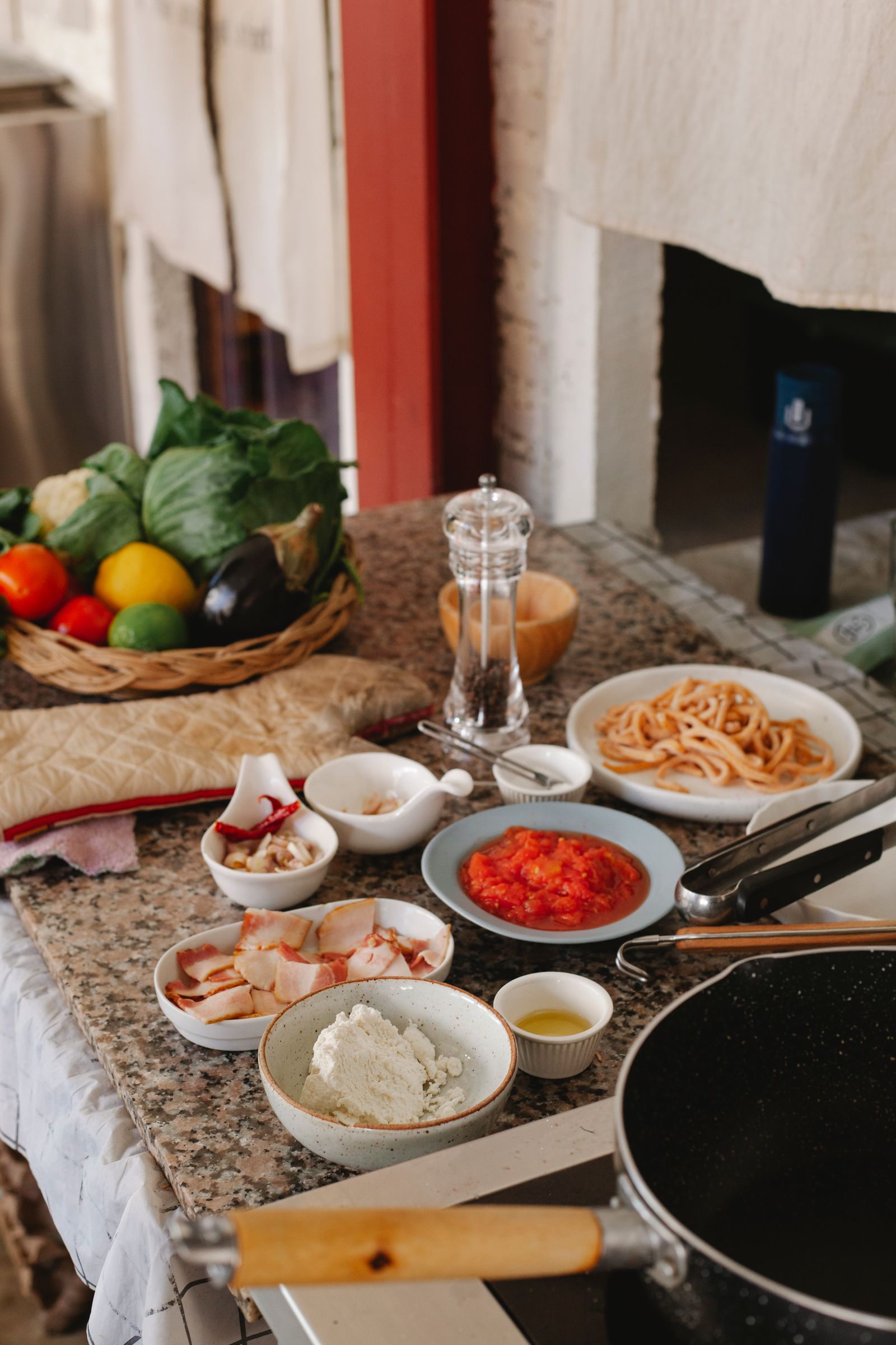 A close-up of fresh pasta ingredients on a rustic kitchen table, perfect for Italian cooking.