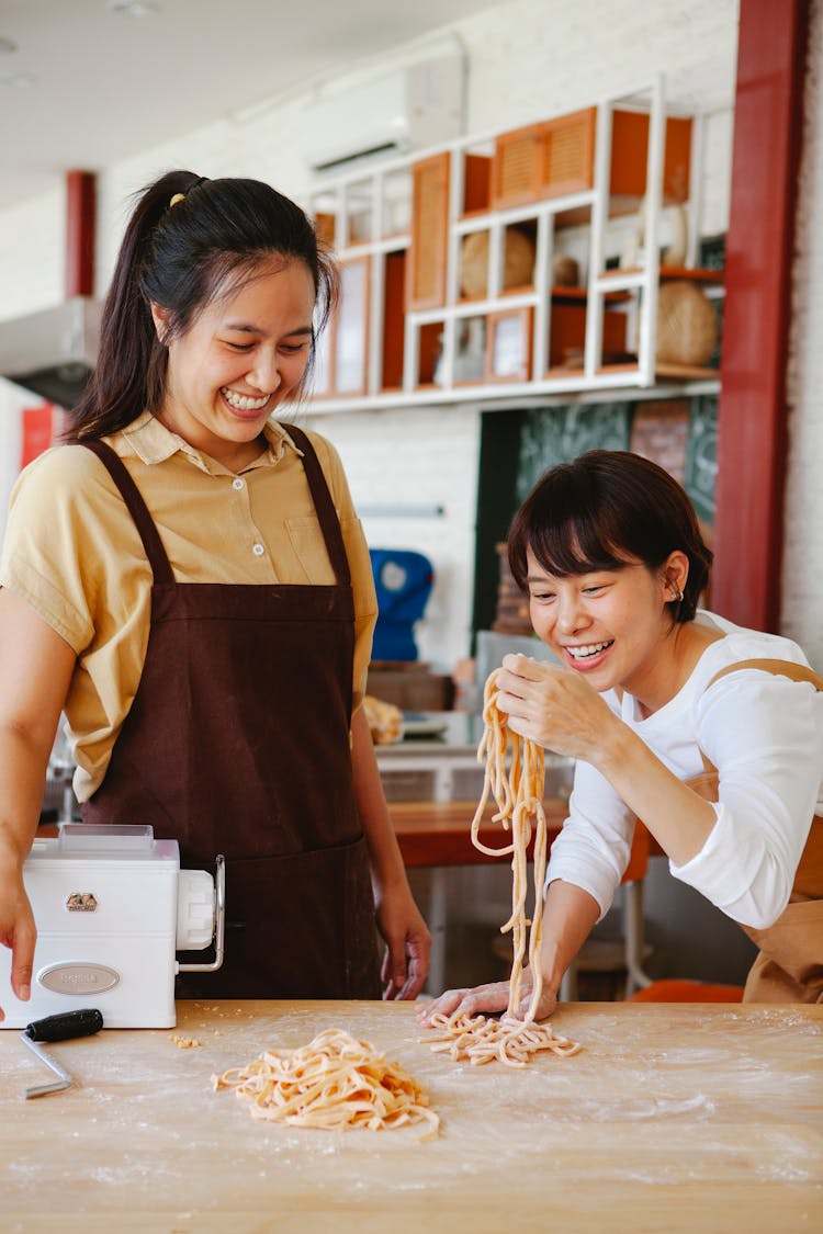 Smiling Woman Making Pasta