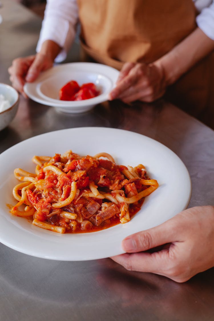 Hands Holding Plates