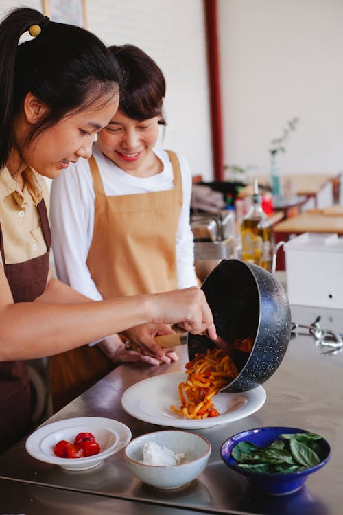 Free Women Cooking at Restaurant Kitchen Stock Photo
